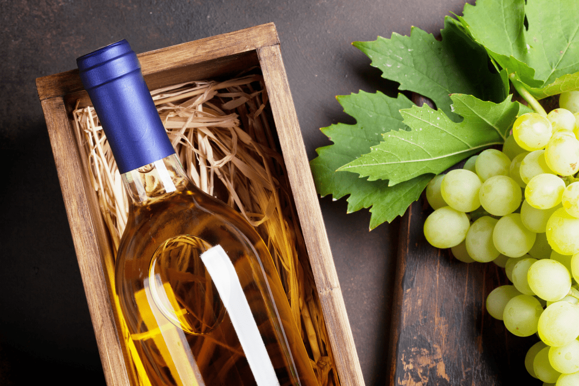 vegan white wine in wooden packaging with grapes