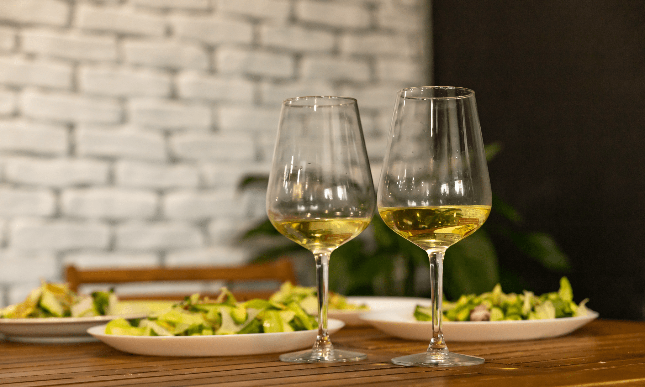 white vegan wine with fresh vegan salad